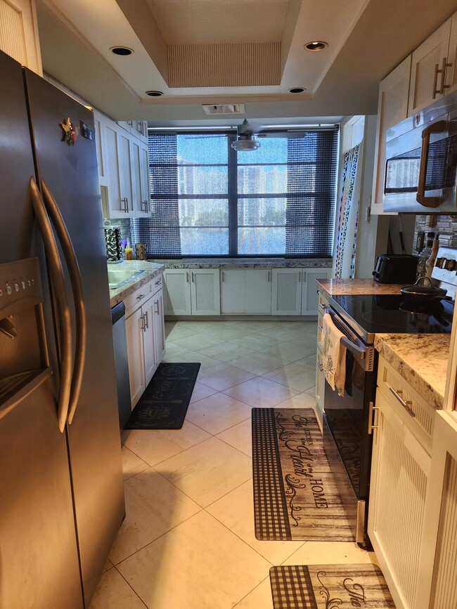 Kitchen with Stainless steel appliances - 18081 Biscayne Blvd