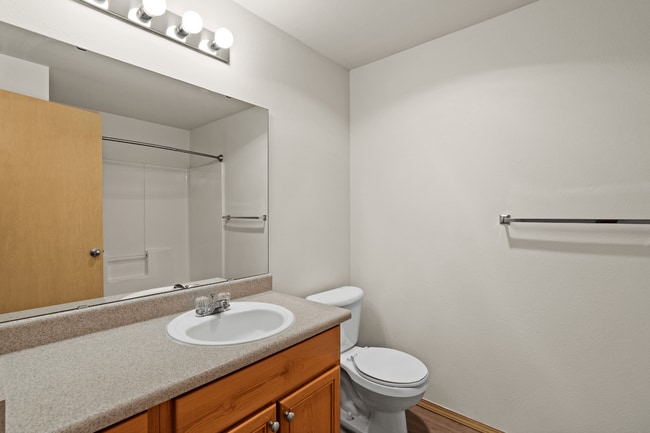 A clean and functional bathroom designed for everyday convenience. - Villas at Lawrence