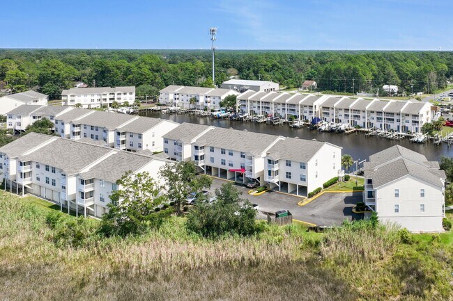 Building Photo - WATERFRONT LIVING! BEAUTIFULLY APPOINTED CONDO ON THE BAYOU IN OS SCHOOL DIST - FULLY FURNISHED