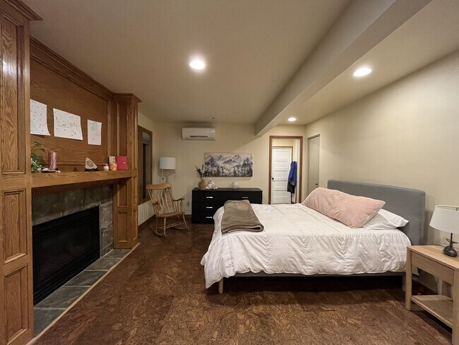 Building Photo - One-of-a-Kind Custom Home with Wall of Windows, Stone Fireplaces, Expansive Entertainment Space &...
