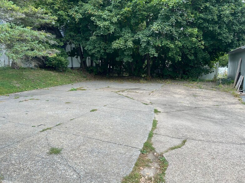 Parking lot behind home - 7614 Collins St