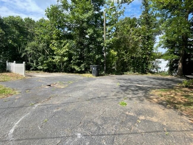 Building Photo - Introducing WesleyHeights401, a charming 3...