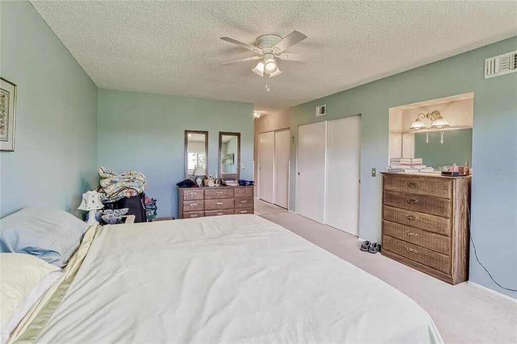 Master bedroom has 2 closets, ceiling fan, bathroom & view of golf course. Walls have been repainted - 2460 Franciscan Dr