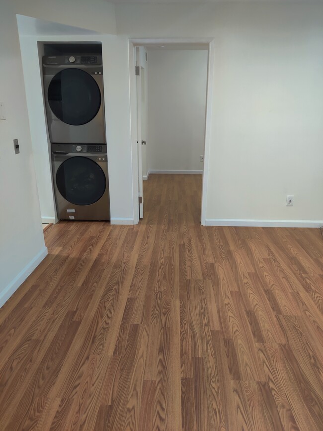 Living room with new washer/dryer - 117 Lighthouse Ct