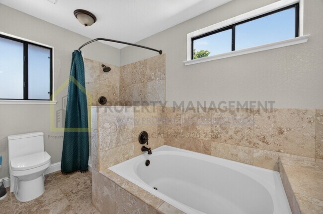 Building Photo - Spacious 4-Bedroom Retreat with 2.5 Baths