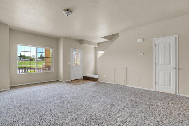 Building Photo - Modern Townhome with Central A/C, 2-Car Ga...