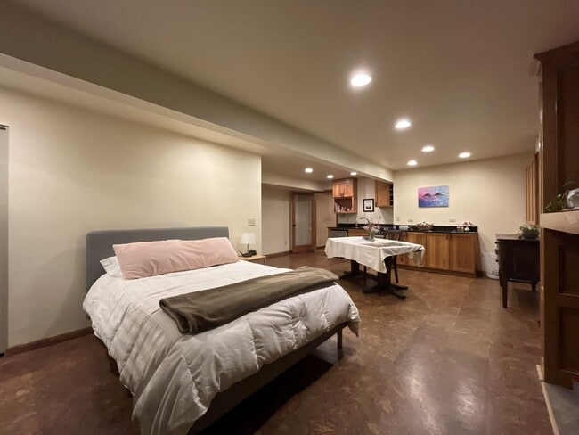 Building Photo - One-of-a-Kind Custom Home with Wall of Windows, Stone Fireplaces, Expansive Entertainment Space &...