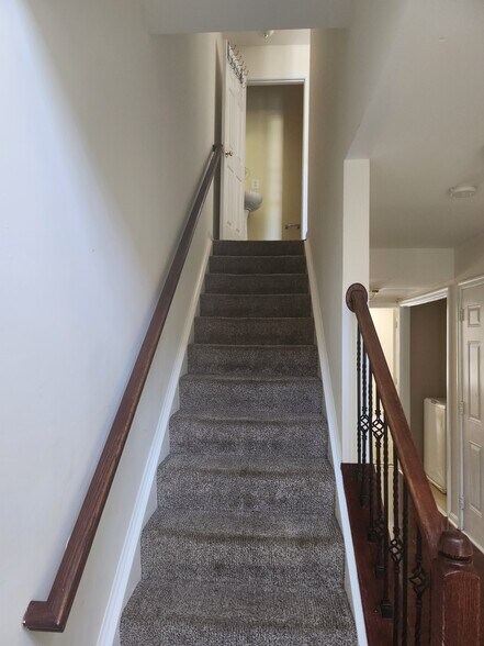 First stairwell with half bath at the top of the stairwell - 109 Coral Reef Ct