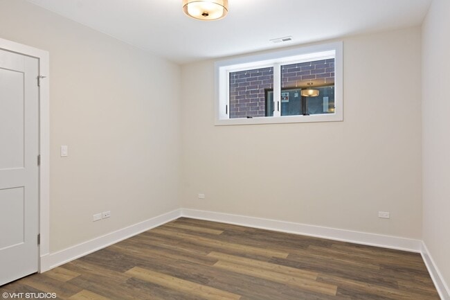 Building Photo - Condo Quality 3,400 SF Duplex Down in Roscoe Village, Pet Friendly Available August 1st