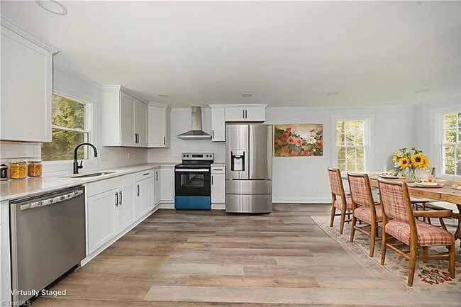 Building Photo - Earn Wealth While Leasing - Like a Homeown...