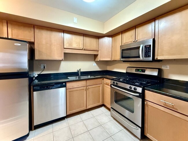 Building Photo - Pristine 2 Bedroom, 1 Bathroom Condo Available NOW! Heat, Water, & Parking INCLUDED in Rent!