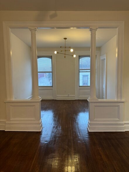 Sunny street facing room with tons of natural light and modern chandelier - 118 Philip St