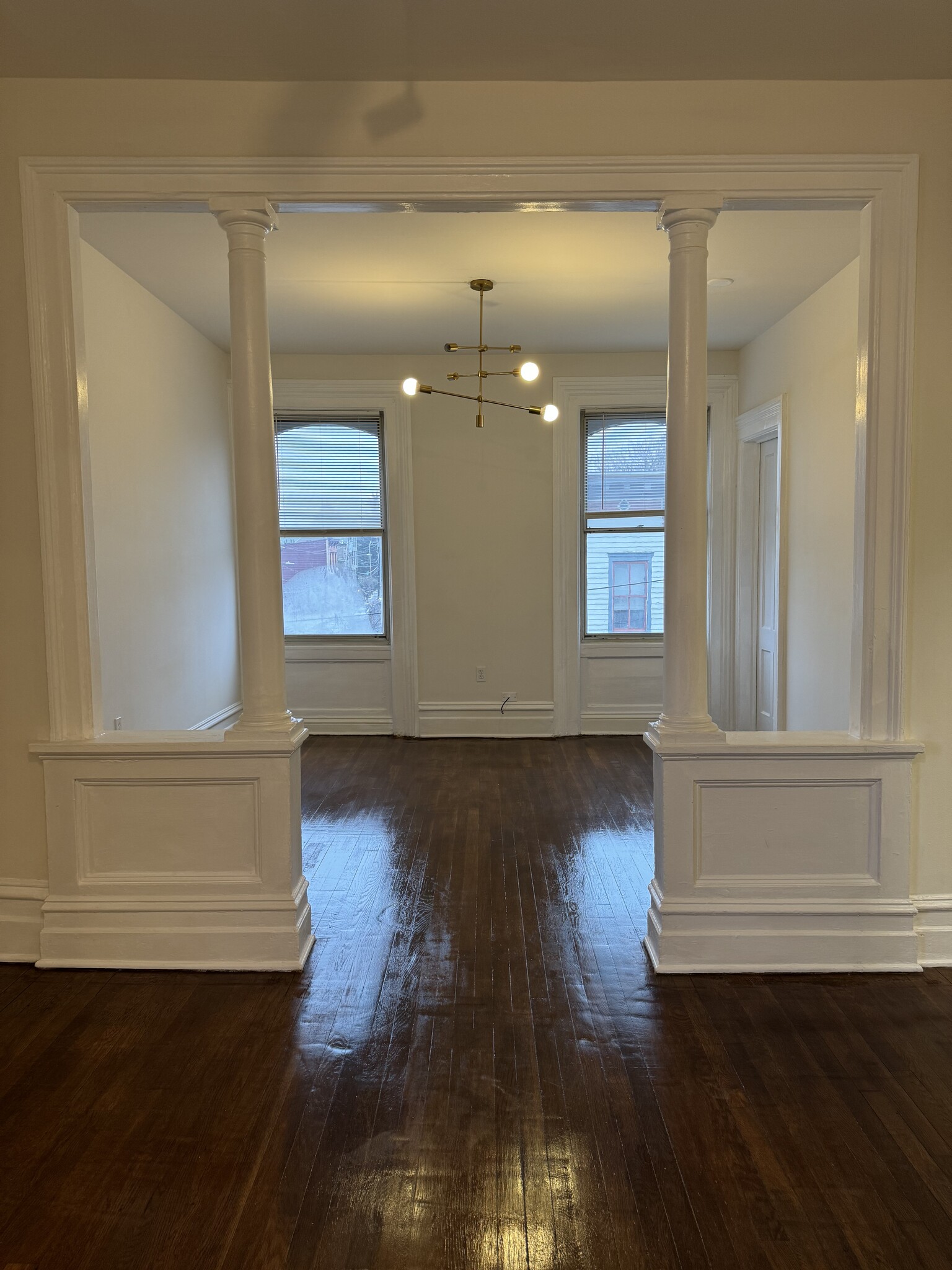 Sunny street facing room with tons of natural light and modern chandelier - 118 Philip St