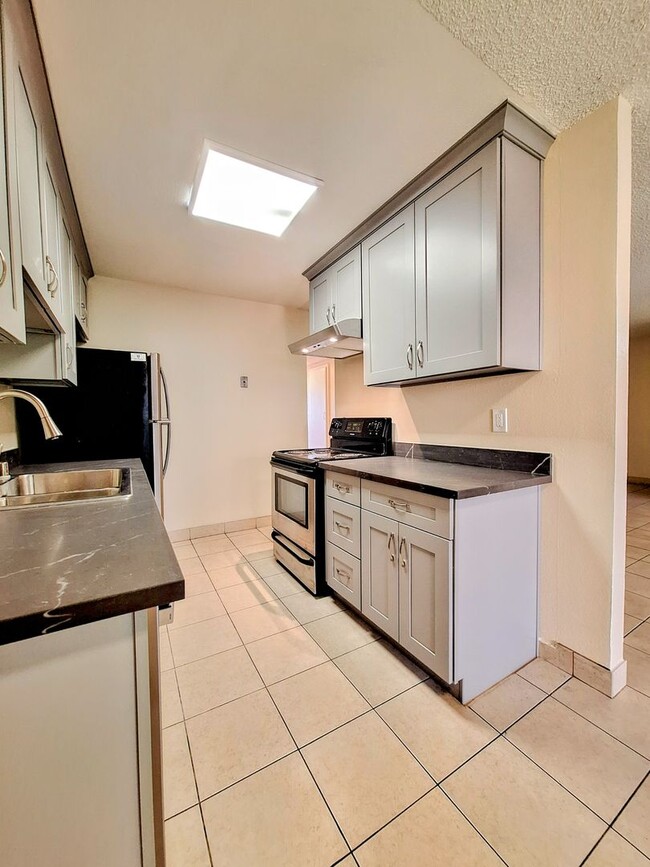 Building Photo - Beautifully Remodeled Second Floor Condo A...