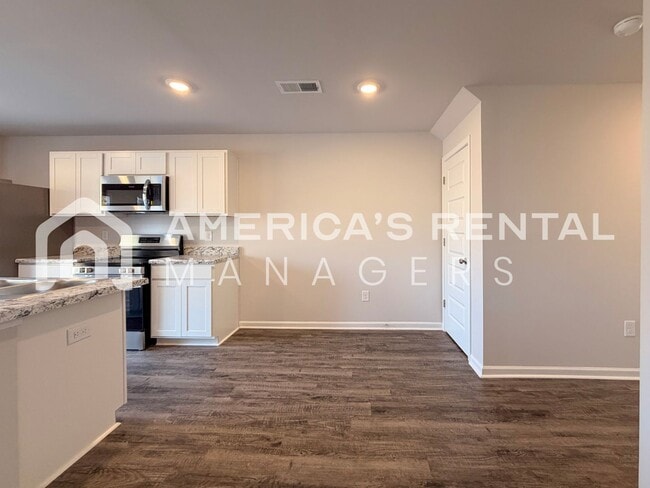 Building Photo - Spacious Two-Story Townhome with Open Layout!