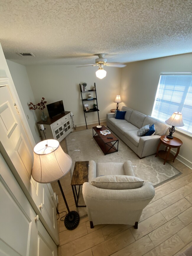 Den with coat closet & ceiling fan, new floors - 111 Michael Dr