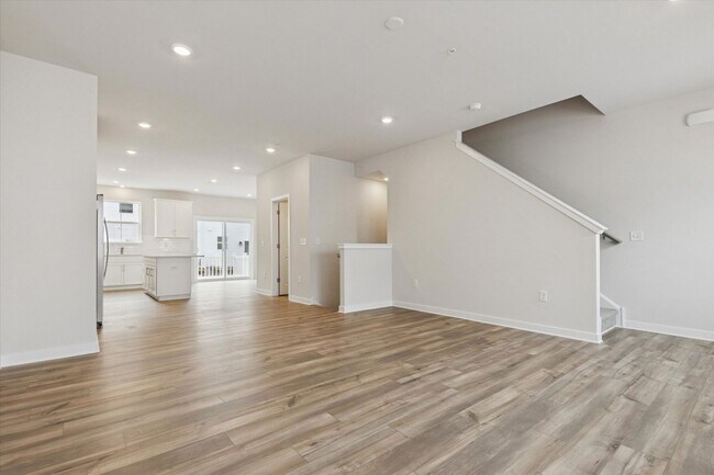 Building Photo - COMING SOON! Brand New River Pointe townhome with modern finishes, flexible living space, and a p...