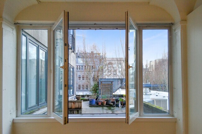 Building Photo - North Park Lofts - Historic Pearl District Warehouse Studio w/parking/most utilities/rooftop patio
