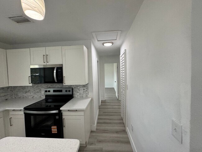 Building Photo - Recently Renovated 4/2 Home with Open Layout & Huge Backyard