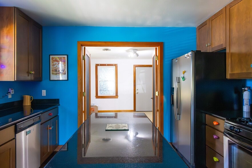 Kitchen leads to large bonus room - 3311 River Rd