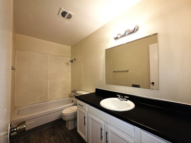 Building Photo - Large 2 bedroom 1.5 bath 2 car garage townhouse new custom flooring and paint throughout with new...