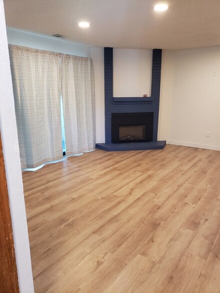 Electric fireplace in large living room / dining room area. - 8378 S Upham Way