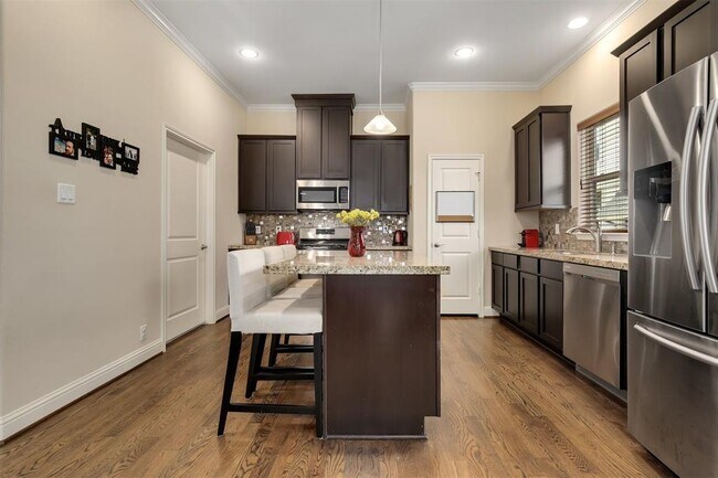 Second Floor Kitchen Space With Laundry Room To Left - 921 W 24th St