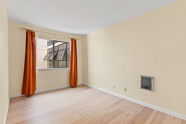 Building Photo - Modern Oakland Living: New Floors, Private Balcony, and Parking