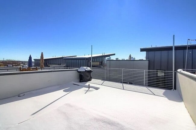 Building Photo - Modern LoHi Living with Rooftop Deck & City Views!!