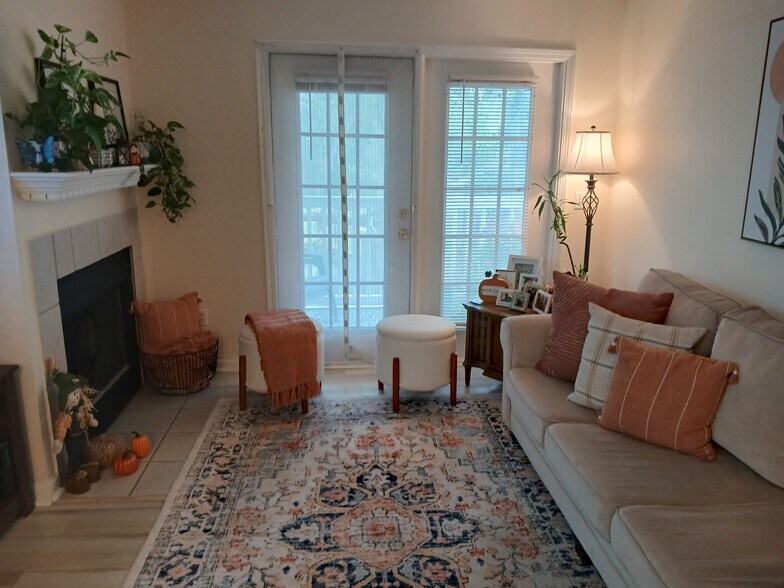 Living room with french doors to deck - 100 Kensington Blvd