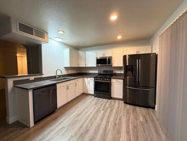 Building Photo - $500 OFF 1ST MONTHS RENT Updated 3-Bedroom Townhome in Gated Community with Pool Access