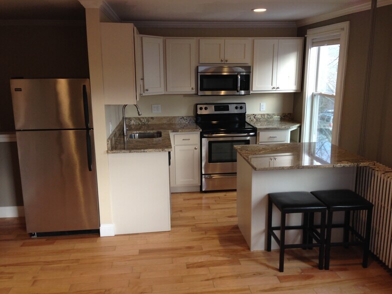 Updated kitchen with breakfast bar - 282 Brackett Street