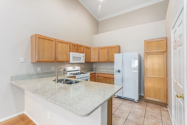 Building Photo - GATED SUMMERLIN CONDO/COMMUNITY POOL/SPA/ BASKETBALL COURT-2 CAR ATTACHED GARAGE!