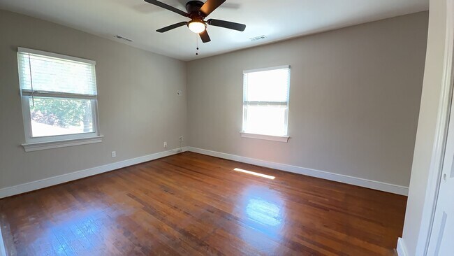 Building Photo - Charming 2BR with Sunroom, Hardwood Floors & Lawn Care Included