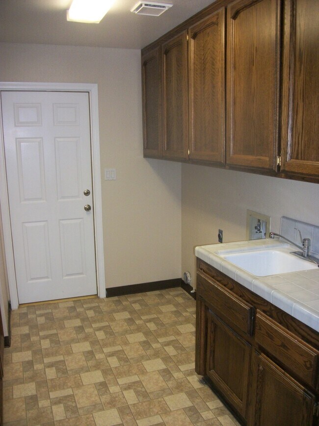 Building Photo - Coming Soon: Spacious Renovated 3 Bedroom Rosedale Home with Pool, Dual Fireplaces & Covered Patio