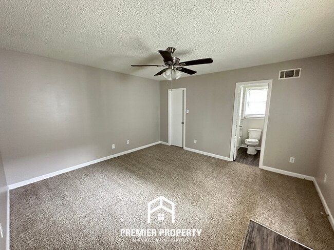 Building Photo - Quiet 3BR/2BA Cove Near Southwind | Soaring Ceilings & Floor-to-Ceiling Stone Fireplace