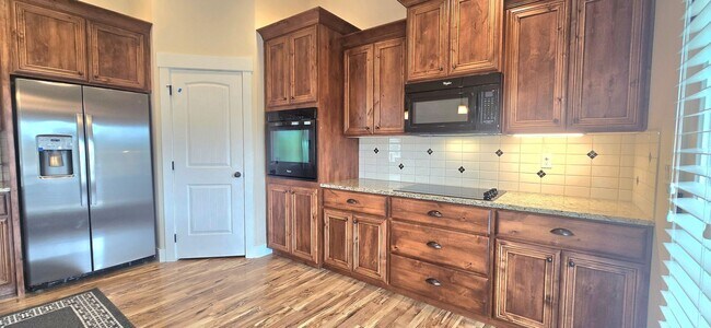 Building Photo - THREE-CAR GARAGE! This charming home offers 3 bedrooms, plus an office/rec room, and 2 bathrooms.