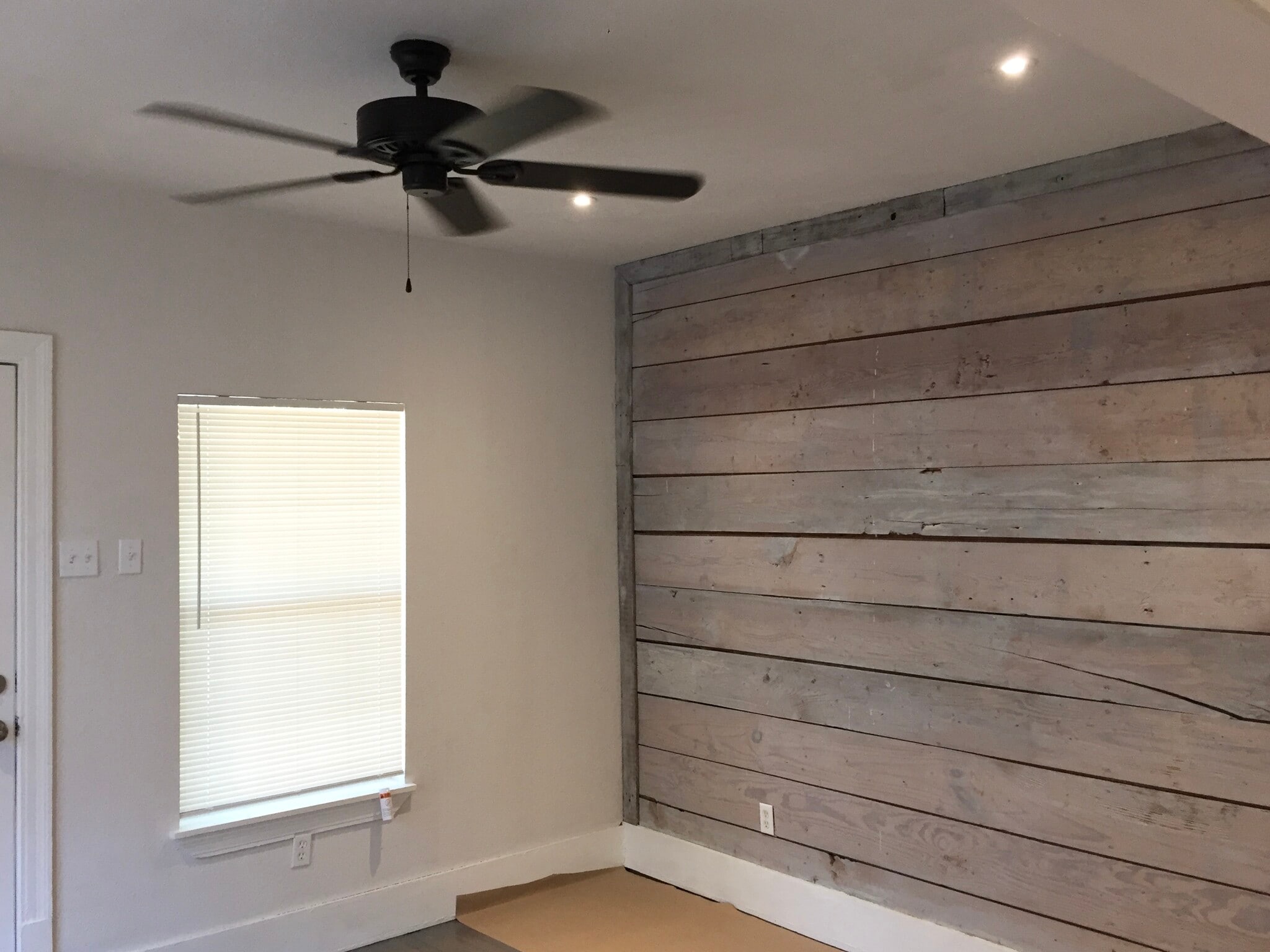 Living room with original shiplap accent will - 1131 W Lynwood Ave