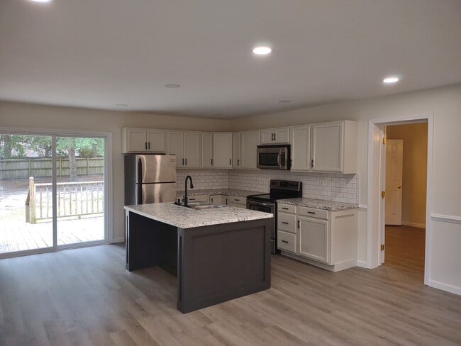 Building Photo - Tastefully Upgraded Four Bedroom Brick Hom...