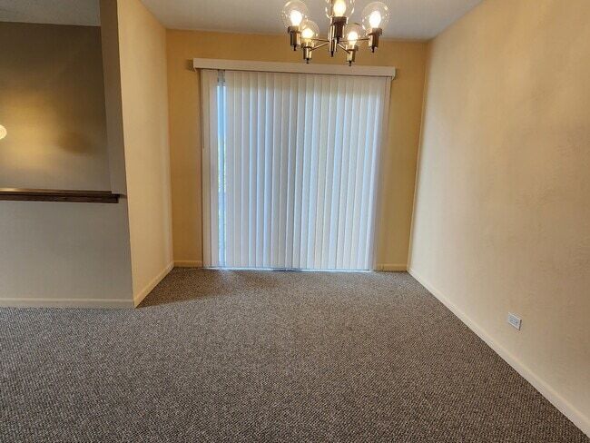 Dinning area with vertical shades closed - 326 Plumwood Ln