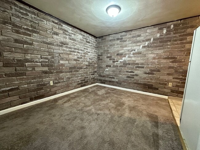 Building Photo - One Bedroom Apartment with Exposed Brick & Off-Street Parking! Tour this Stunning One Bedroom Today!