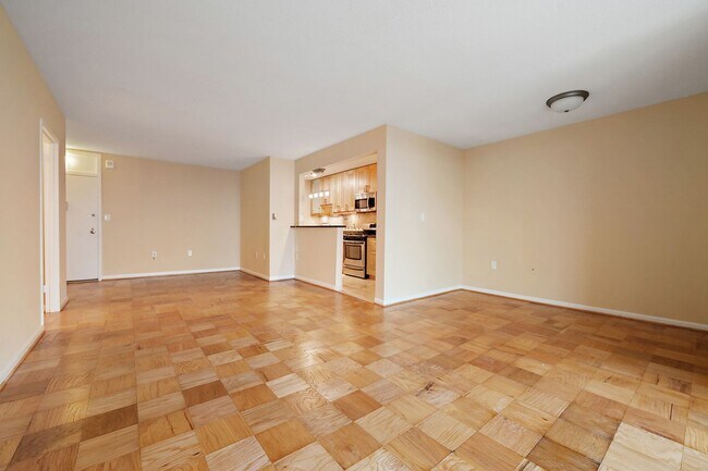 Building Photo - Spacious, and Sunlit 1 BD/1 BA Condo w/Reserved Garage Parking and Utilities Included in Chevy Ch...