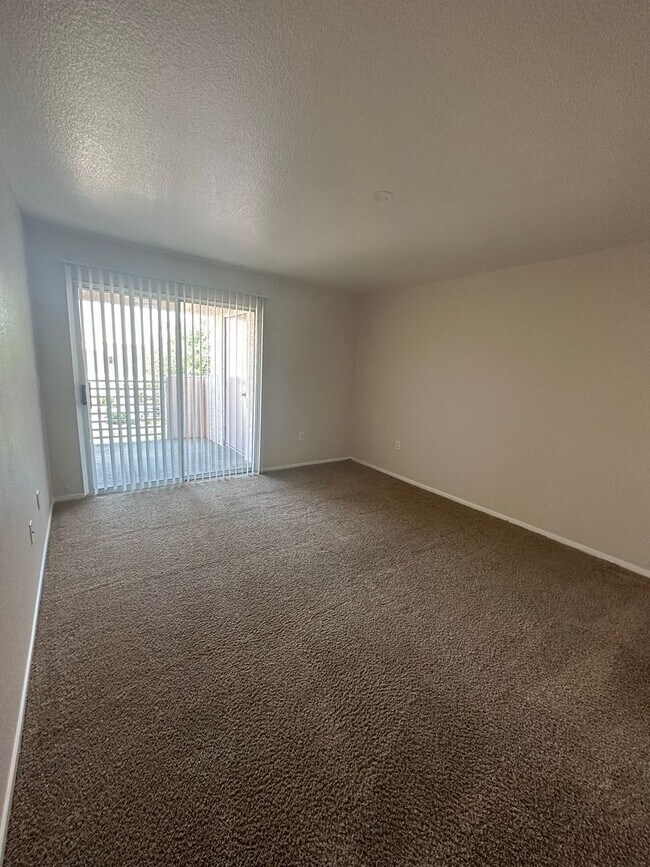 Building Photo - Cozy Condo with fireplace in living room.