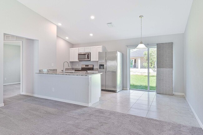 Building Photo - Spacious Three-Bedroom Home with Open Floor Plan, Large Yard