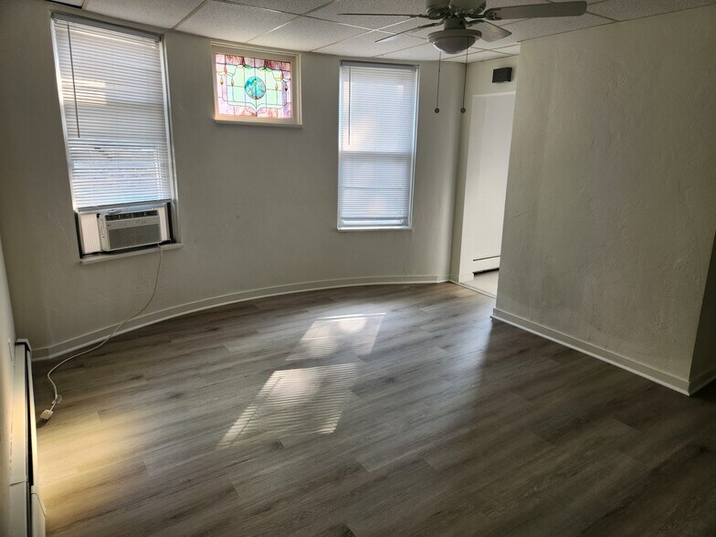 Dining or Second Room with unique curved wall and window AC unit - 61 N Linwood Ave