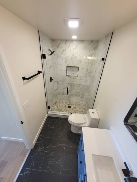 River rock shower - 508 Orena St