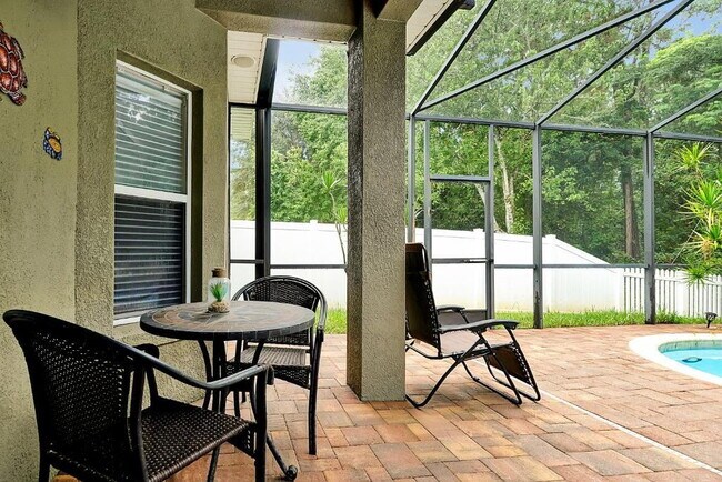 Building Photo - "Stunning 3BR Orlando Home with Private Screened Pool, Spa & Spacious Living Areas"