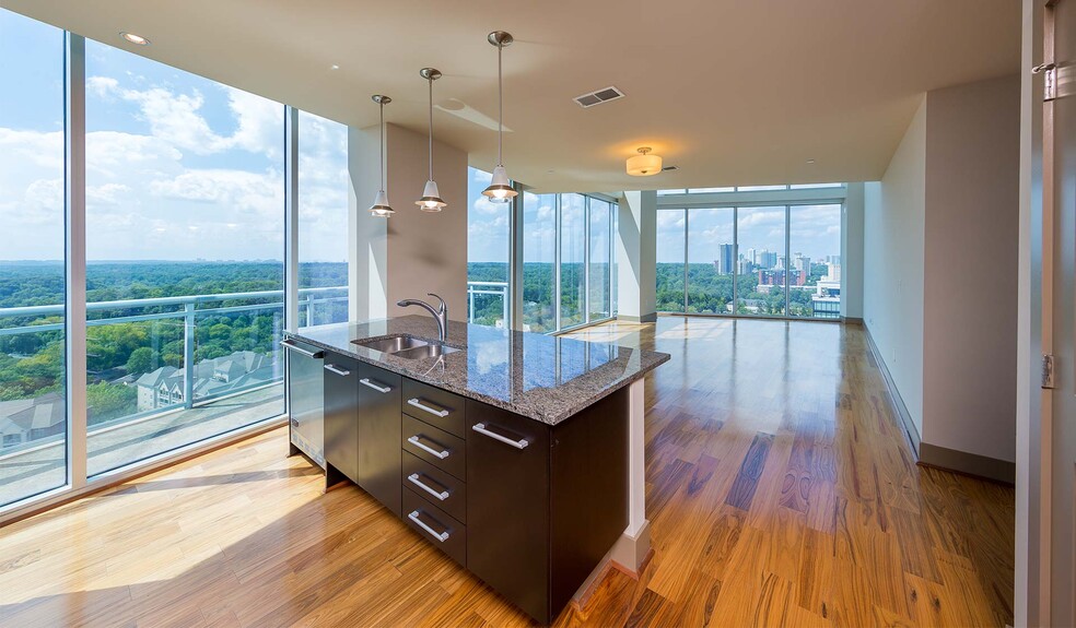 Spacious living room with ample natural light - Mezzo Apartments