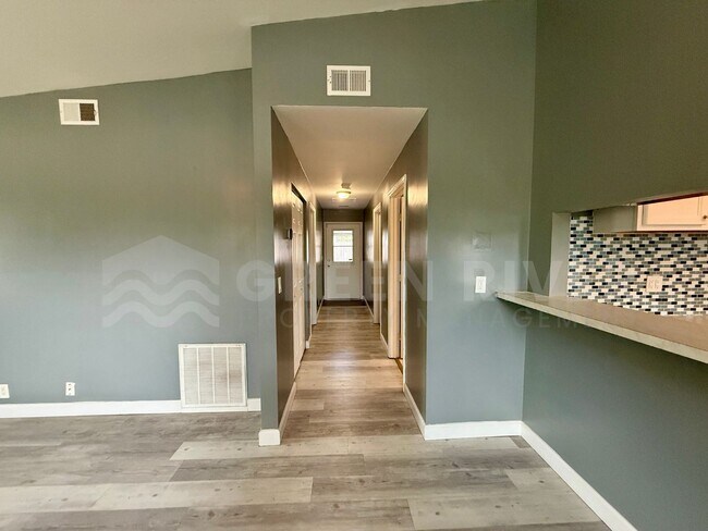 Building Photo - Fully Renovated 2BR Brick Home with Vaulted Ceilings & Backyard Retreat!