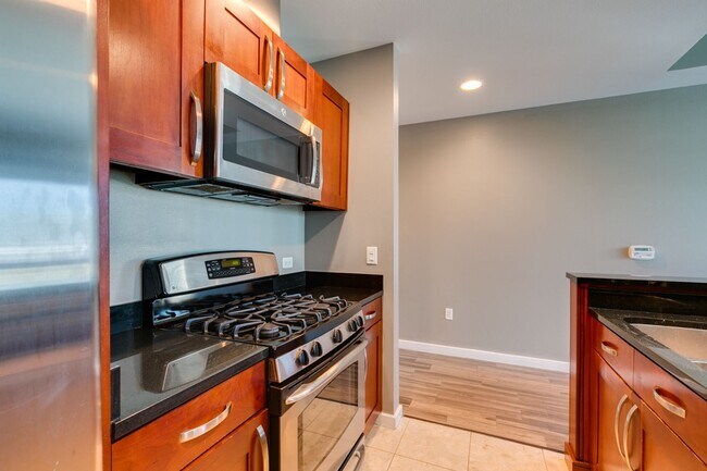 Building Photo - Iconic Strip-View Luxury | Elegant 1BR + Den High-Rise Residence